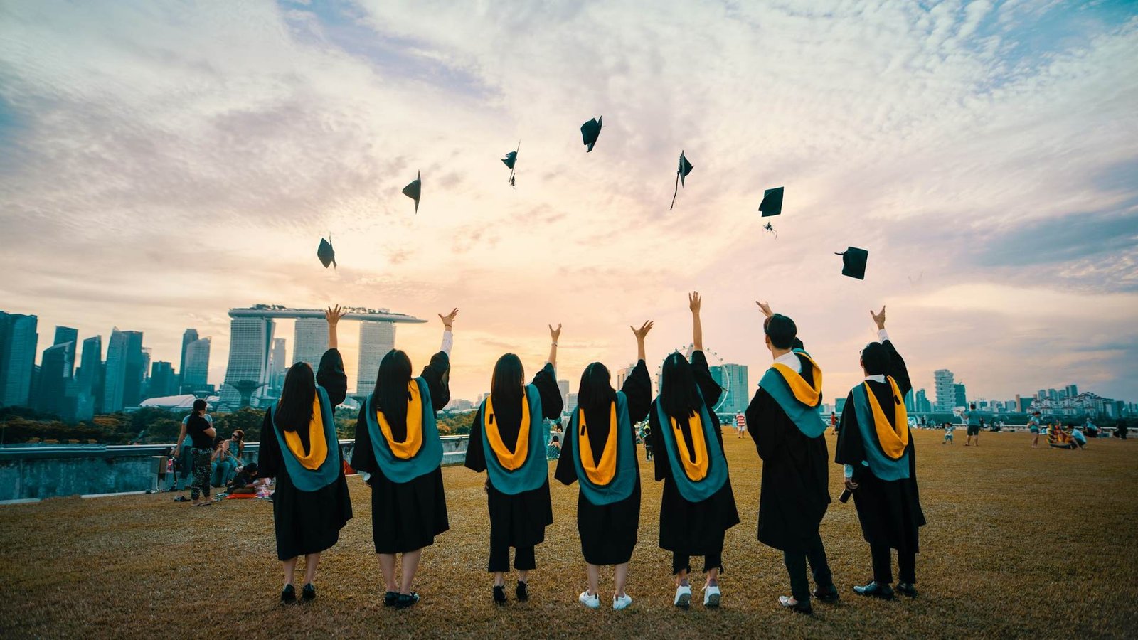 International students celebrating graduation, supported by Britannia Education Partners' UK and Middle East consultancy